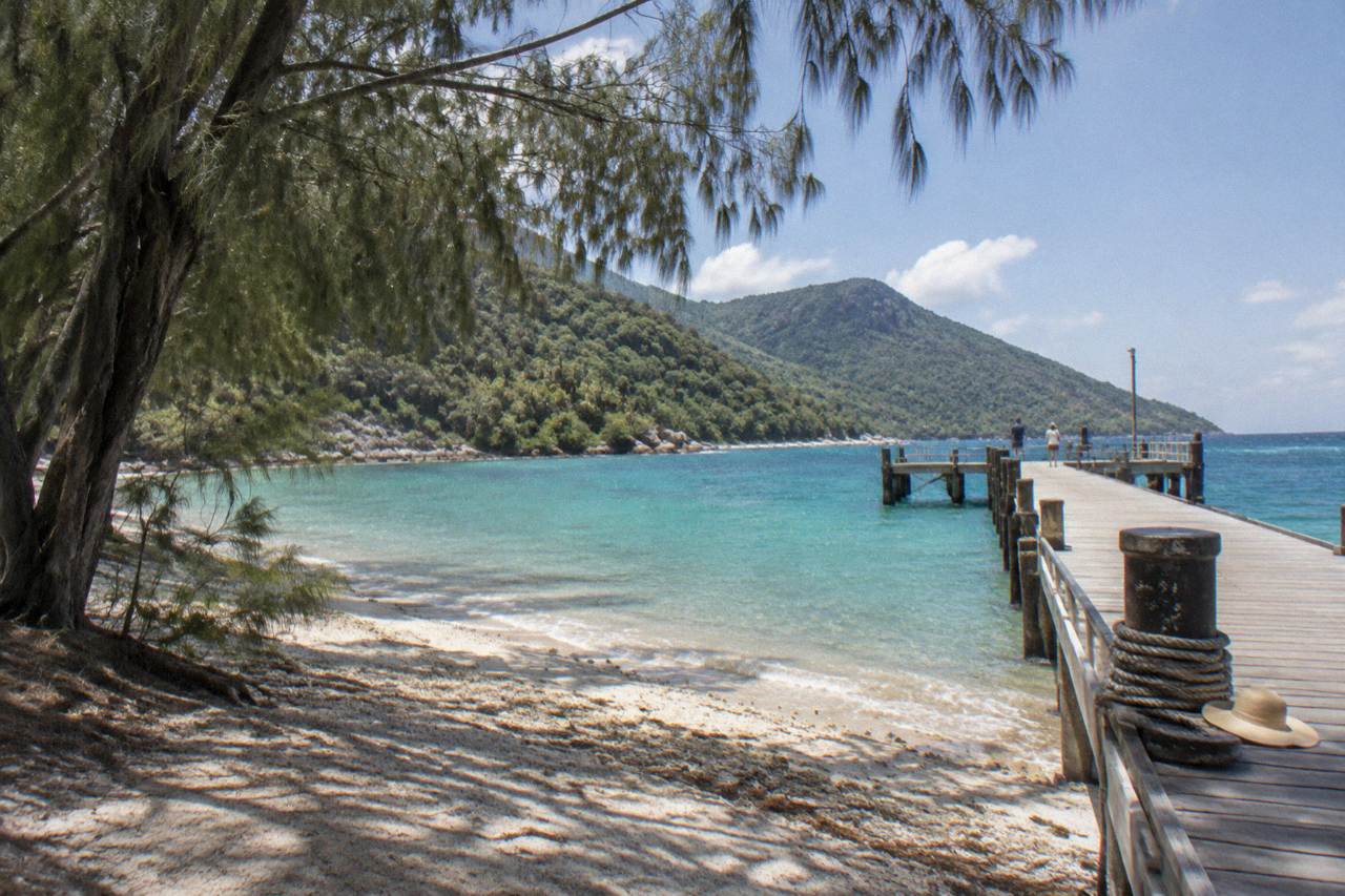 Calm turquoise water and coral beach at Welcome Bay on Fitzroy Island