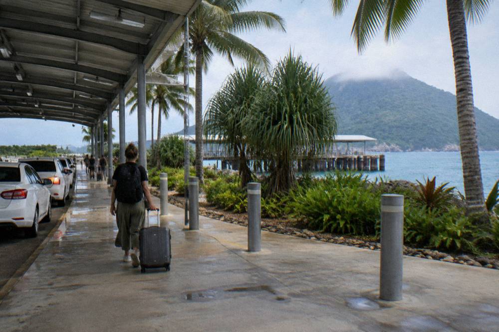Cairns airport arrivals forecourt with taxis waiting in daylight